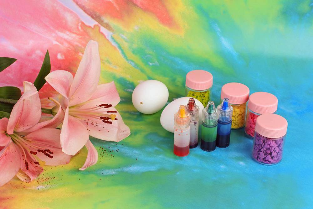 Materials for decorating eggs in a colorful background