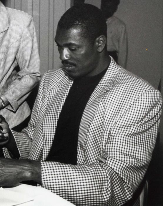 Hakeem Olajuwon signing an autograph