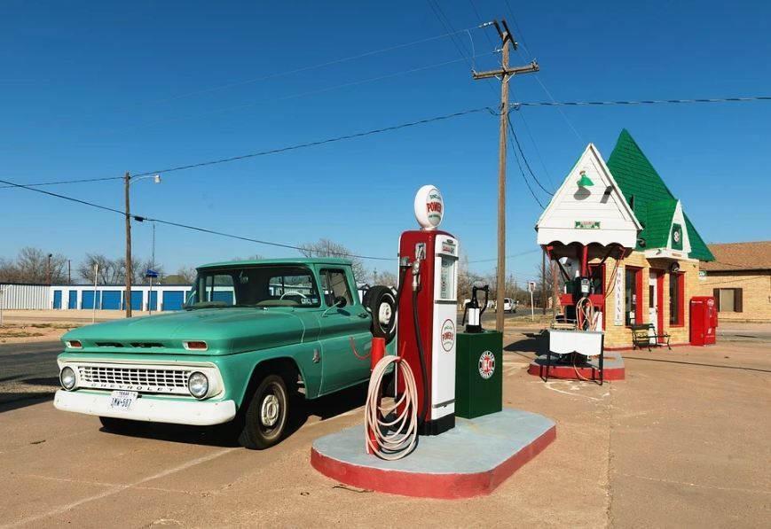 a Texan petrol station with a car.