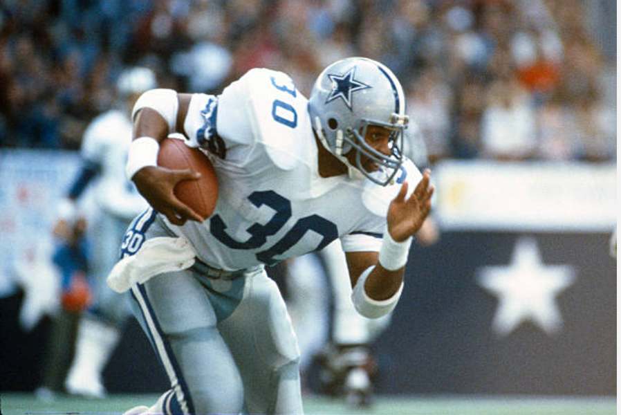 Timmy Newsome of the Dallas Cowboys carries the ball