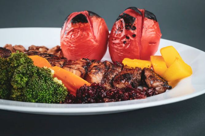 fruits and vegetables on a plate with meat