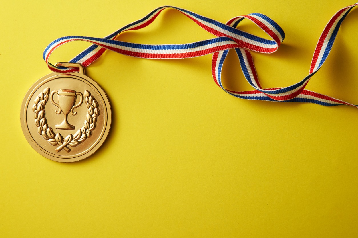 gold medal on the yellow color background