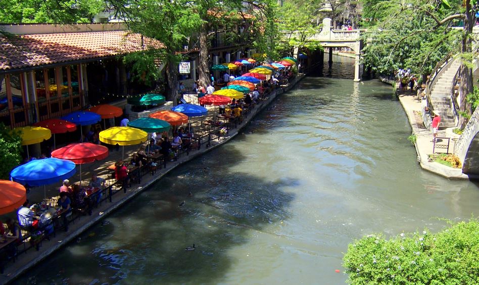 colorful umbrellas along the shores of the San Antonio River Walk