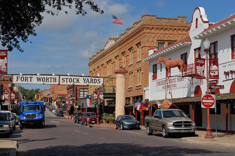Exchange Avenue, The Stockyards Hotel, Fincher's White Front Western Store, and cars in the Fort Worth Stockyards Historic Distric