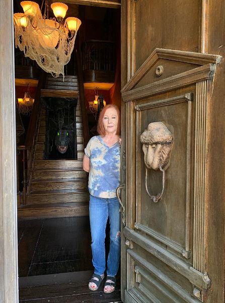 owner Sandra McKee at the entrance to Munster Mansion replica in Waxahachie, Texas