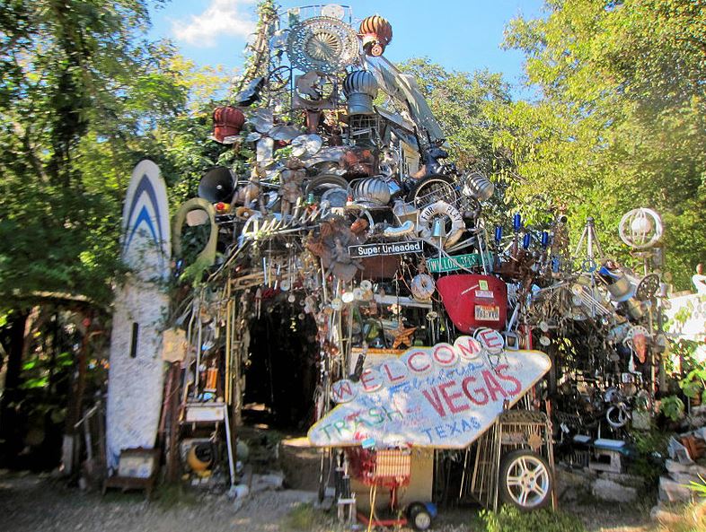 the Cathedral of Junk surrounded by trees