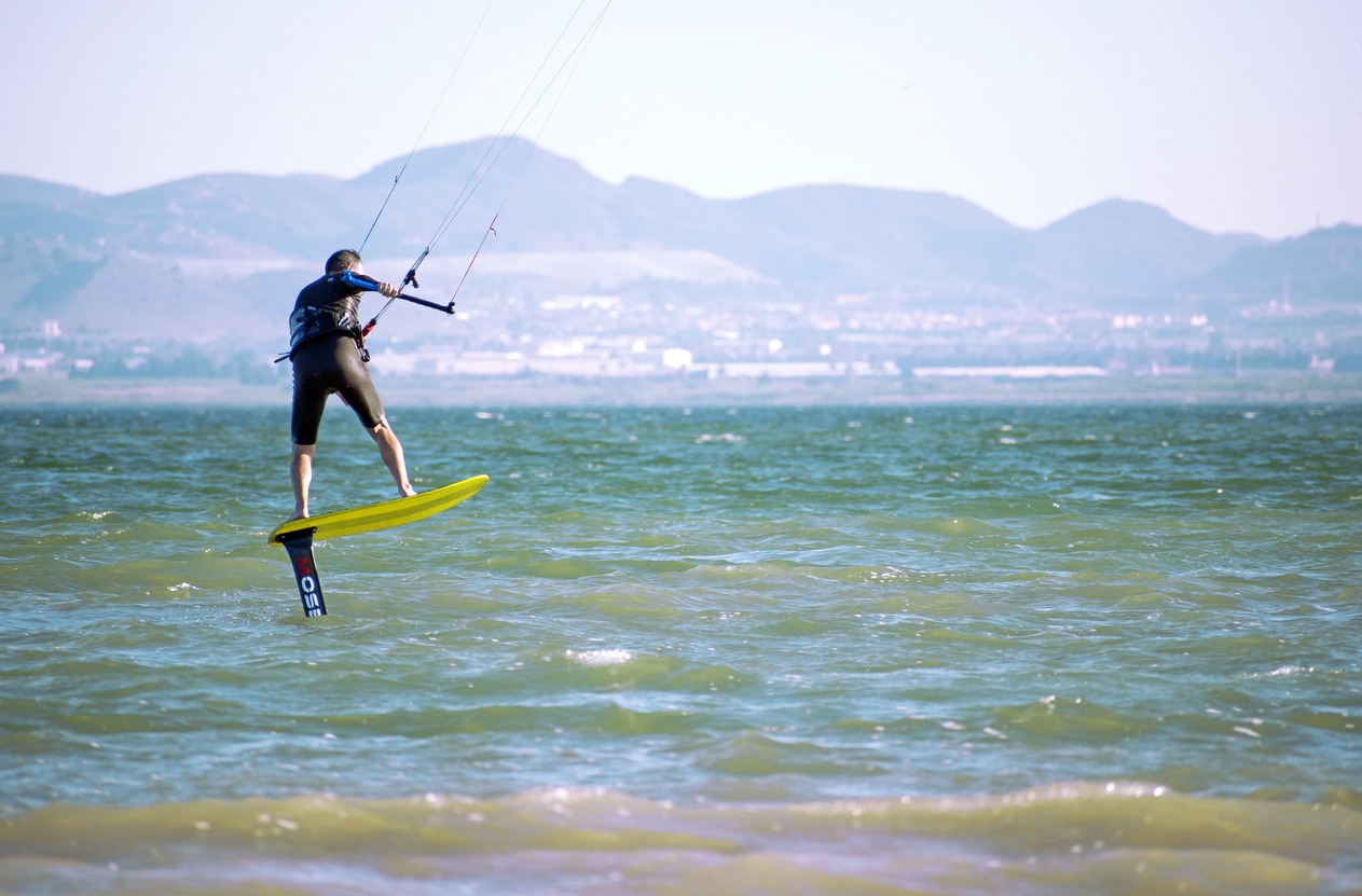 Sportsman practicing hydrofiol kite surf