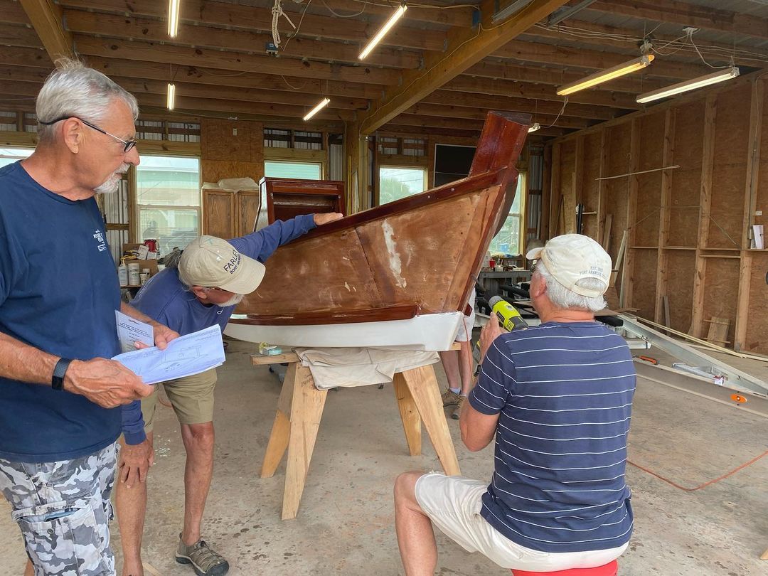 Boat Builders busy working on a boat