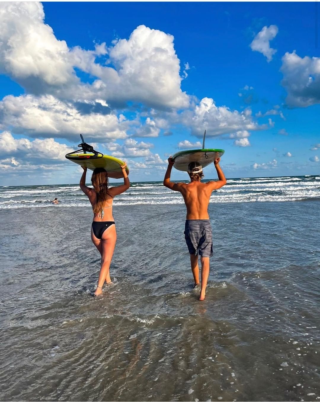 Couple about to go surfing