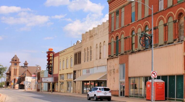Downtown-Stamford-Texas-orange-and-peach-buildings-white-car