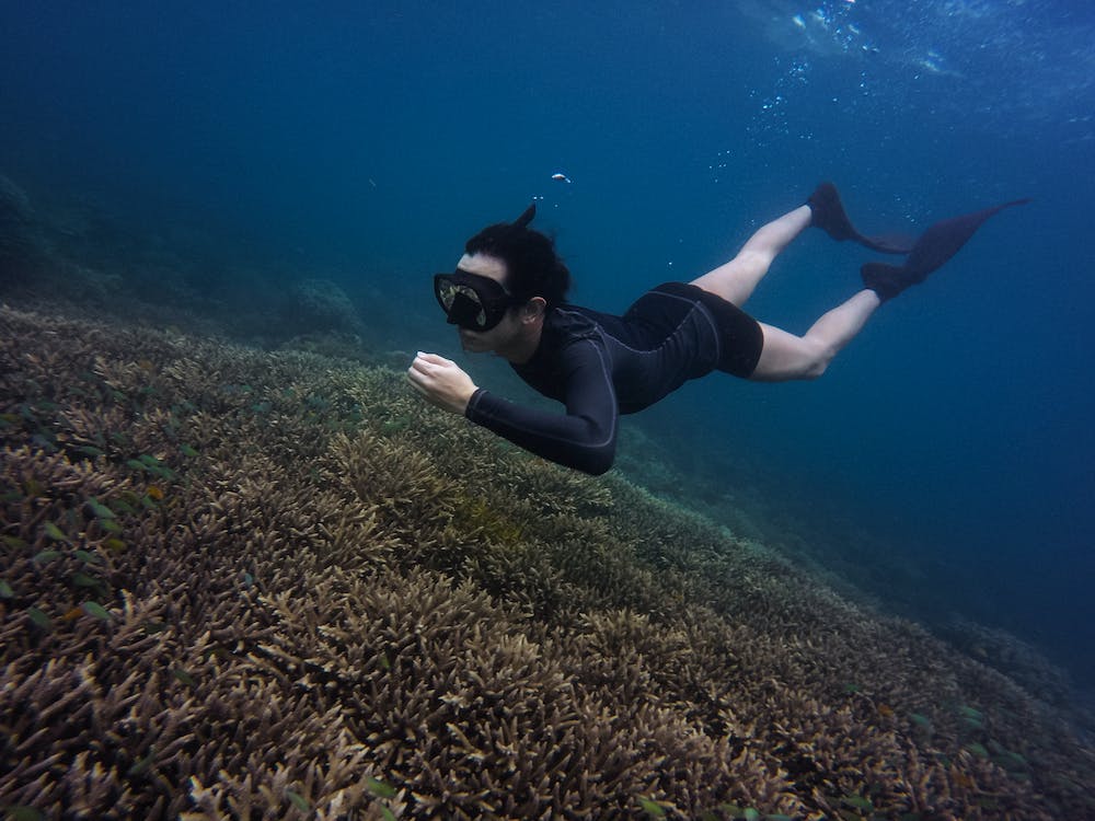 Woman Swimming Underwater