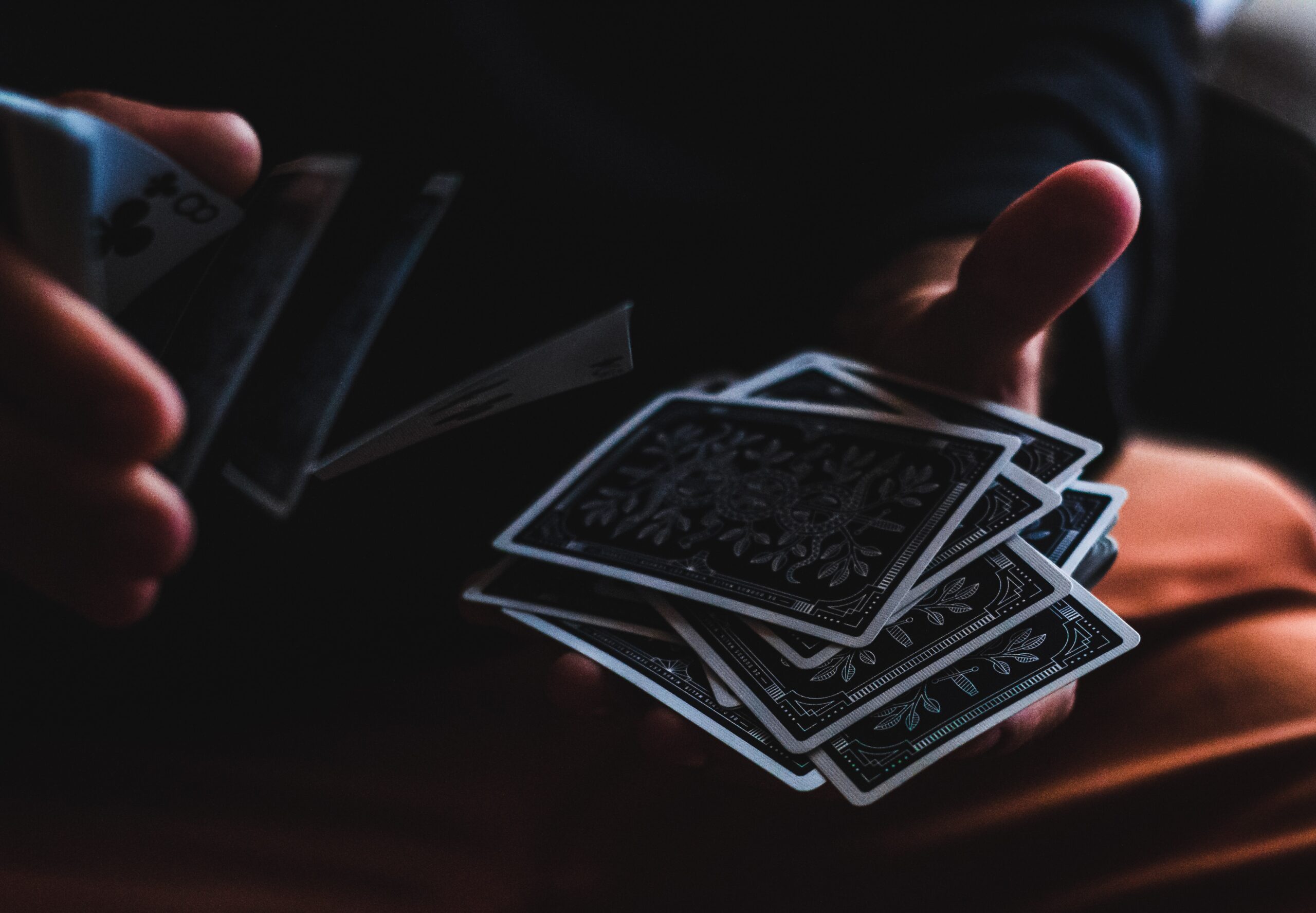 a-person-performing-magic-tricks-through-cards