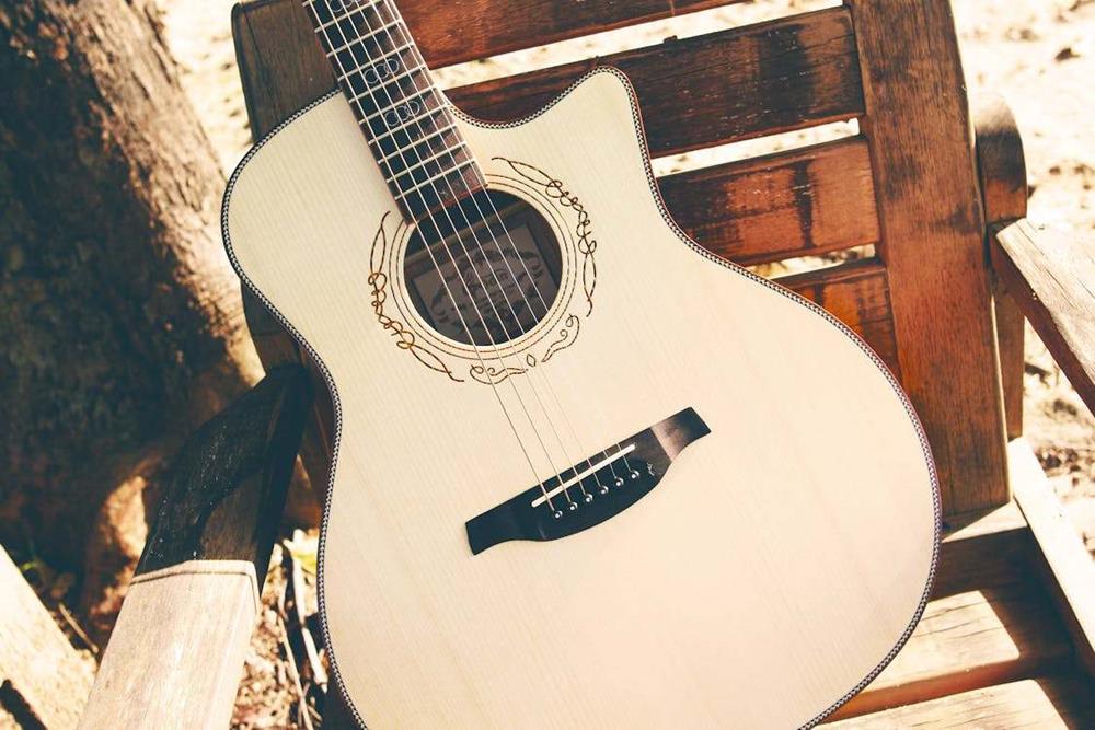Acoustic guitar placed on a chair