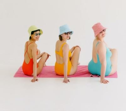 women wearing a swimwear, sitting women, different body types