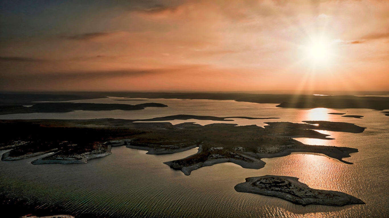 Aerial view of Amistad Reservoir in Texas in a vibrant sunset sky background