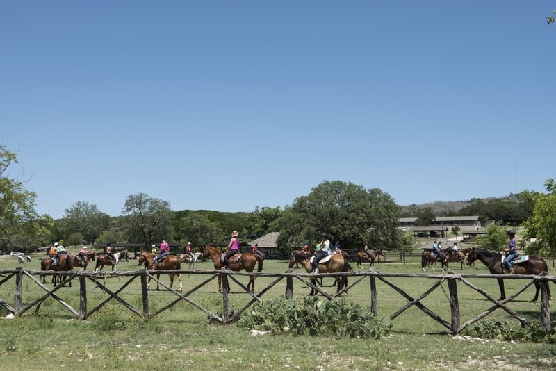 Horseback riding lessons at Camp Waldemar, one of several summer camps in the Texas Hill Country near the town of Hunt, near Kerrville in Kerr County, Texas