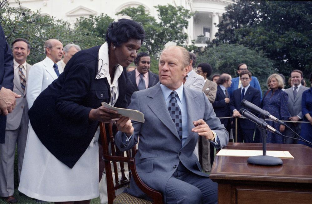 Barbara Jordan and President Gerald R. Ford at a signing ceremony