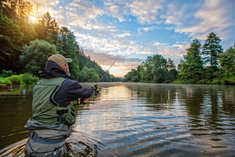 a man fishing in a picturesque kale