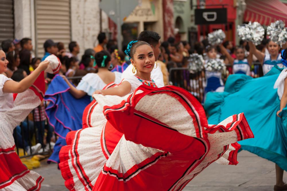 A woman dancing at Charro Days fiesta