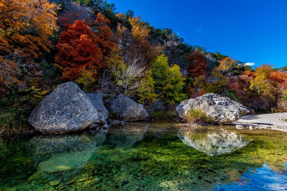 Amazing fall colors at clear pool in Lost Maples State Park