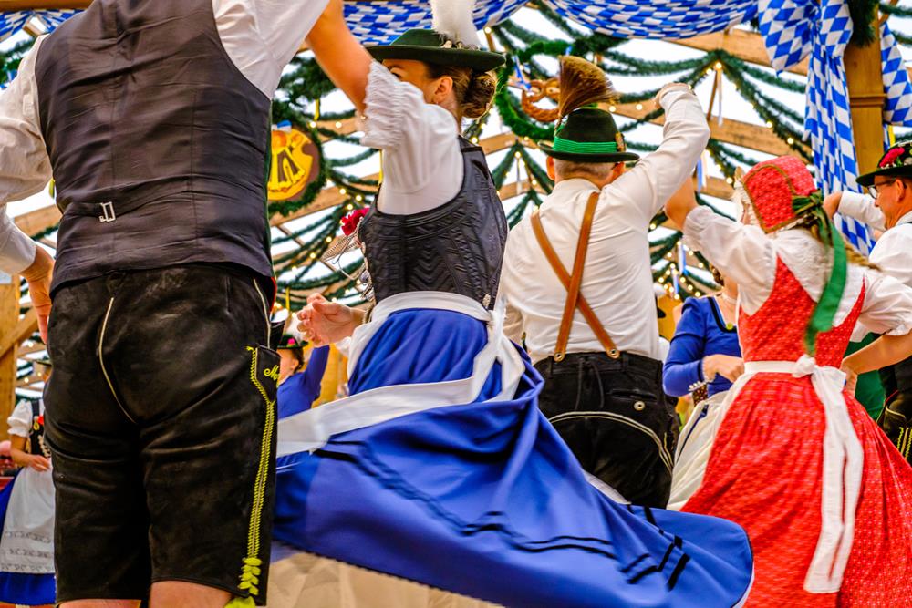 Bavarian couple dancing at a German festival