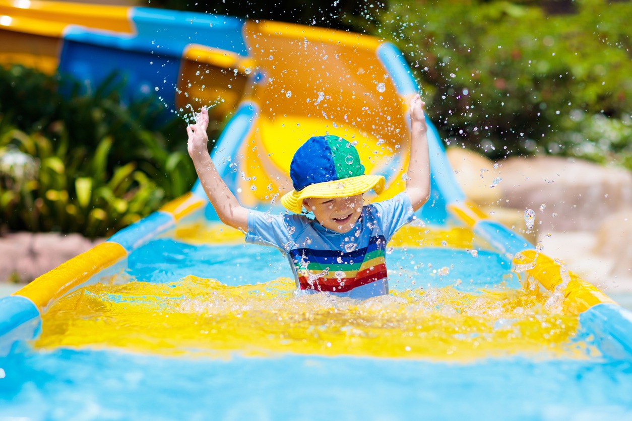 Kids on water slide in aqua park