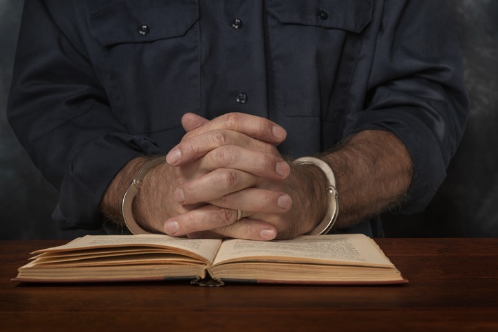 a prisoner reading a book
