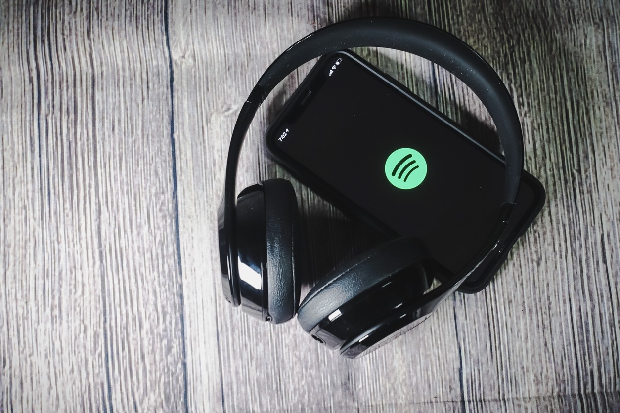 an iPhone 11 screen showing Spotify icon