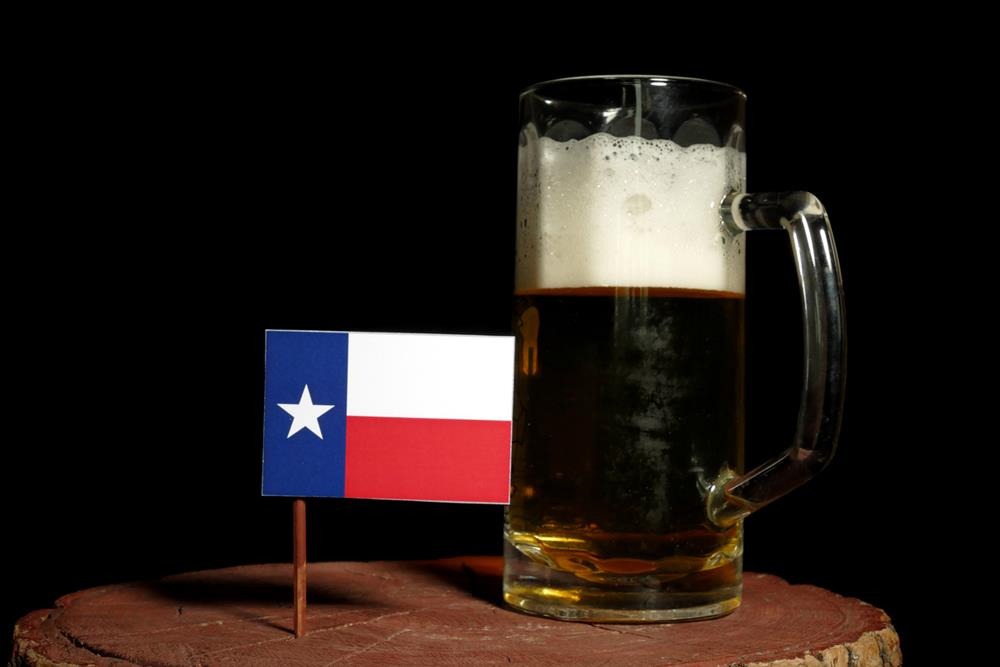 A mug of beer with a Texas flag