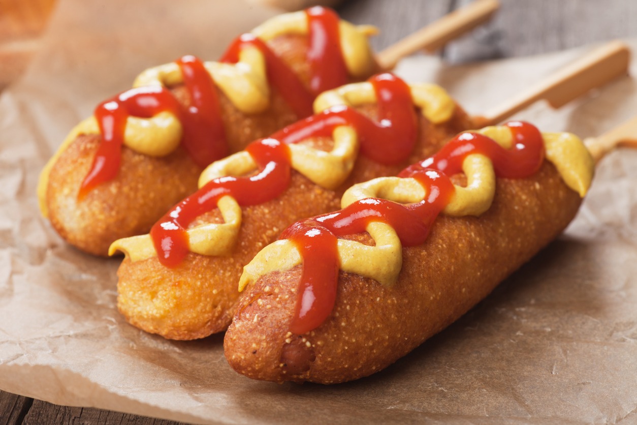 corny dogs with mustard and ketchup