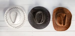 cowboy hats hanging on a wall