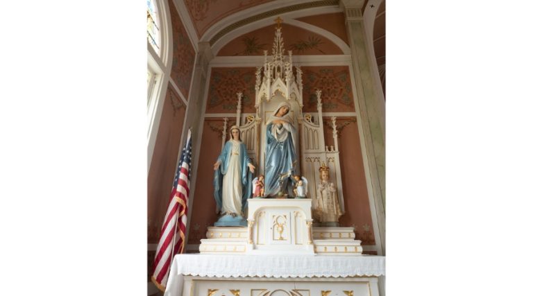 Ornate altar with hand painted Virgin Mary and Jesus Statues in Saint John the Baptist Czech German Catholic Church in Ammannsville, Texas