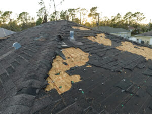 a black roof destroyed by hail